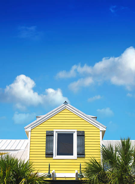 close up shot of yellow house over blue sky_